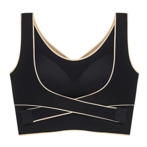 Black seamless sports bra with front buckle and cross-strap design for yoga and fitness