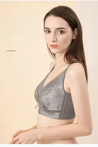 Detail of grey floral lace minimizer bra showing breathable fabric and side support