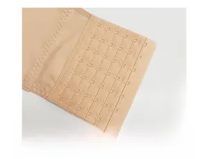 Detail of the high-density skin-tone fabric with seven rows of metal hook-and-eye closures