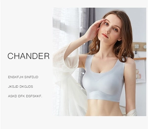 Detail of light grey seamless sports bra featuring wide straps and breathable fabric