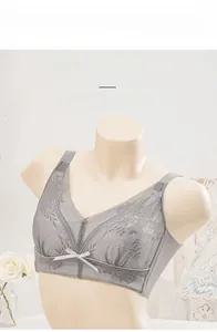 Close-up of light grey floral lace full cup bra showing mesh details and bow accent