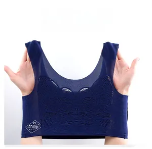 Detailed view of elastic dark blue lace bralette showing breathable mesh and butterfly pattern