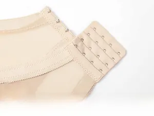 Detailed close-up of four-row hook and eye closure on breathable mesh bra back