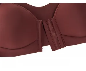 Detailed macro view of the front closure multi-row metal hooks on burgundy bra
