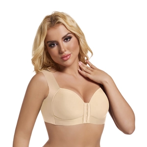 Beige front-closure wire-free bra with wide shoulder straps shown on a model