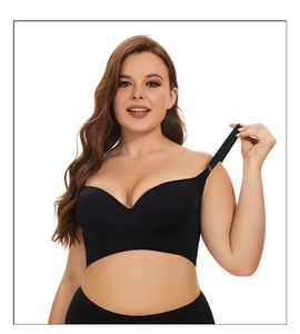 Detail of wide side wings and adjustable straps on black plus size seamless bra