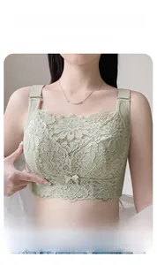 Close-up of light green lace full cup bra with wide straps and floral embroidery details