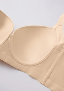 Close-up of seamless inner cup detail and mesh side wings on a beige bra