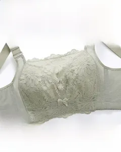 Close-up of light green floral lace texture and bow detail on ultra-thin bra cup
