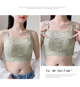 Detail of light green lace bandeau bra showing delicate floral patterns and elastic mesh