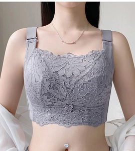 Close-up of full coverage grey lace bralette with floral patterns and bow detail