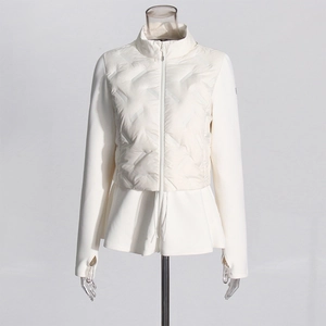 Detail of slim-fit quilted jacket featuring a peplum hem and thumbhole cuffs design