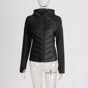 Close-up of women's hooded jacket featuring hybrid quilted panels and thumbhole cuffs