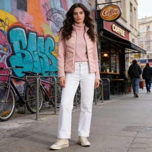 Close-up of pink quilted down vest with metallic zipper and urban streetwear style