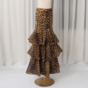 Close-up of layered leopard print chiffon fabric and tiered ruffle design on the skirt