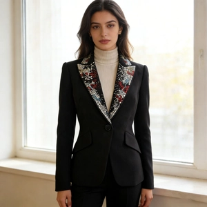 Close-up of elegant black blazer with colorful beaded lapels and tailored slim fit