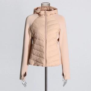 Detail view of pink slim-fit hooded jacket with quilted body and thumbhole cuffs