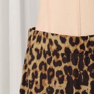 Close-up of leopard print fabric detail showing waistline texture on high waist skirt