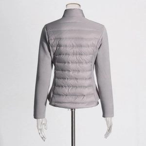 Back view of gray slim-fit jacket showing hybrid quilted design and stand collar