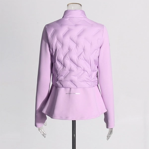 Detail of lilac women's quilted jacket with feminine ruffled hem and logo on back