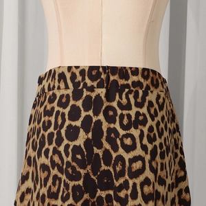 Detailed close-up of leopard print maxi skirt with fine stitching and smooth waistband