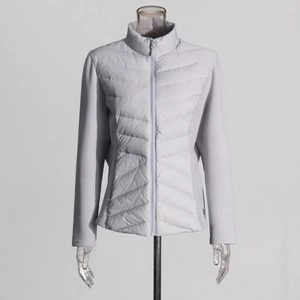 Detail of light down jacket featuring V-shaped quilting and stand collar on mannequin