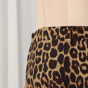 Detail shot of leopard print skirt waistline featuring high-quality stitching and texture