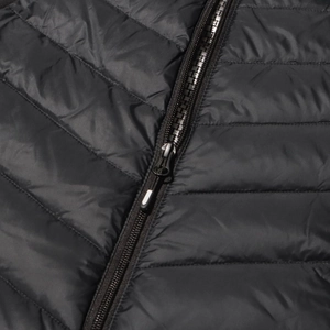 Detail of black quilted down jacket featuring fine stitching and nylon zipper with cord