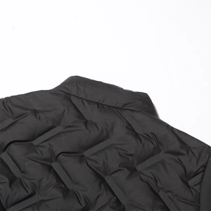 Detail of slim black quilted down jacket featuring stand collar and diagonal stitching