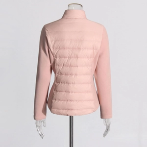 Detail view of pink quilted slim-fit down jacket with hybrid fabric panels on the back