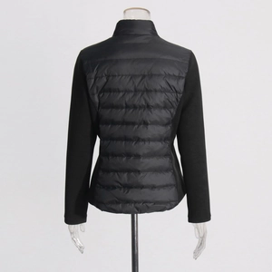 Detail view of the quilted back and slim fit silhouette of this black lightweight jacket