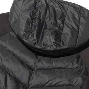 Close-up of a black hooded down jacket featuring horizontal quilting and nylon texture