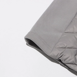 Detail of grey quilted down jacket showing elastic ribbed cuffs and wavy stitch patterns