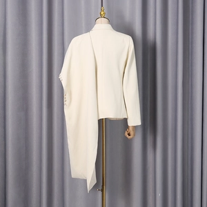 Asymmetric cream blazer with metal ring accents and draped side detail for women