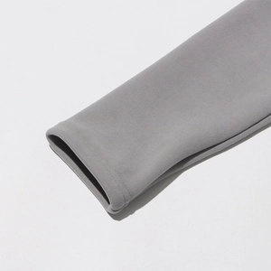 Detailed close-up of the grey sleeve cuff showing fine double-needle stitching and soft texture