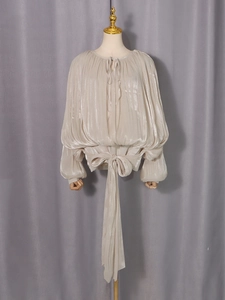 Elegant beige satin pleated long-sleeve blouse with stylish bow tie waist for women