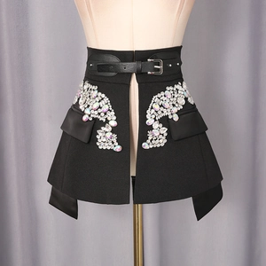 Detail of black waist cincher with intricate rhinestone embellishments and belt buckle