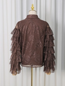 Women's brown lace shirt featuring elegant ruffled layered sleeves and rose patterns