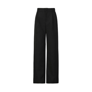 Detail of high-waist wide-leg trousers in black fabric with sleek pleated tailoring