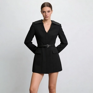 Detailed close-up of a black slim-fit blazer dress with a V-neck and stylish belt