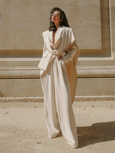 Chic cream blazer set with cape design and wide-leg trousers for an elegant look