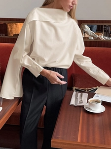 Elegant cream white asymmetrical long sleeve shirt with black high waist trousers