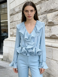 Light blue V-neck ruffled long sleeve blouse with pleated fabric in a minimalist style