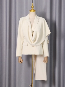 Women's cream white blazer featuring asymmetric draping and crystal drop accents
