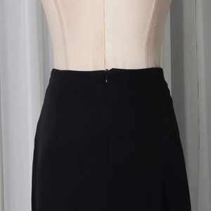 Detail view of the elegant black high waist skirt featuring a hidden back zipper closure