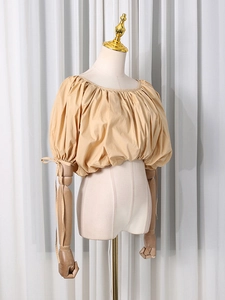 Short apricot puff sleeve blouse with square neckline and bow ties on lantern sleeves