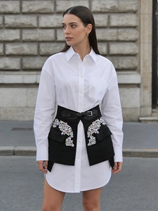 Fashionable black rhinestone-studded lace-up skirt with decorative belt and irregular cut