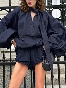Women's dark navy two-piece lounge set with puff sleeve blouse and matching shorts