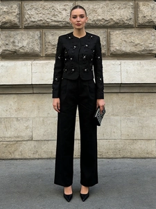 Women's black embroidered blazer and wide-leg pants set with silver star patterns