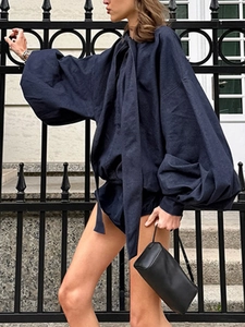 Navy blue two-piece set featuring a tie-neck lantern sleeve top and matching shorts